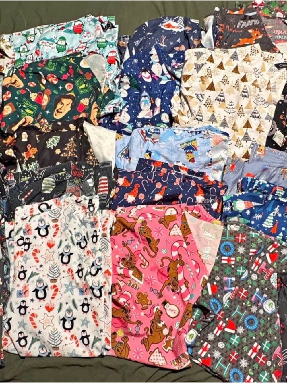 Lot of 25 Christmas size Large scrub tops and 2 long sleeve scrub jackets.